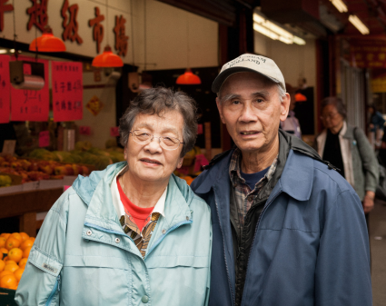 Couple standing in front of small grocery